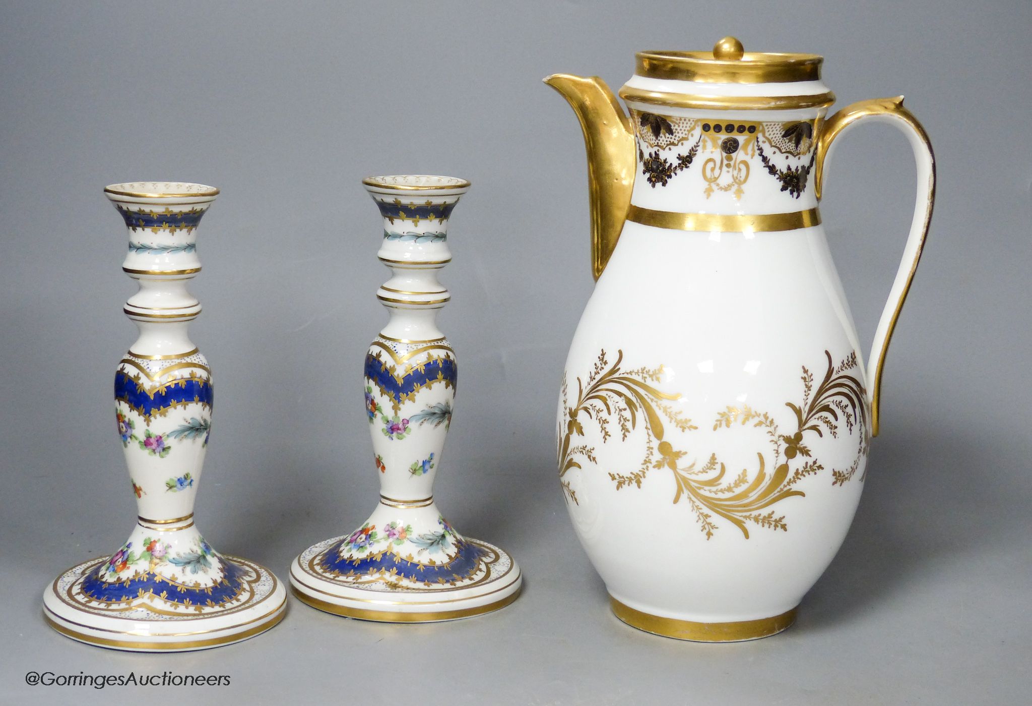 A 19th century Paris porcelain coffee pot and a pair of Dresden candlesticks, tallest 24cm